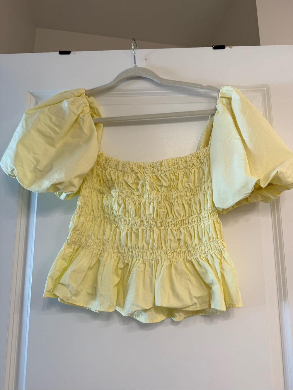 Yellow smocked puff sleeve top